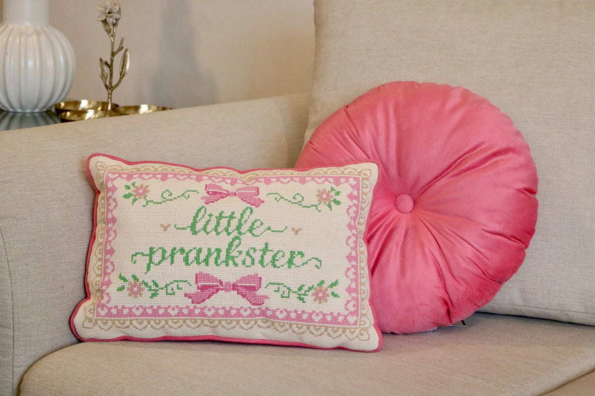 Cross-stitch floral cushion with pink bows, detail view